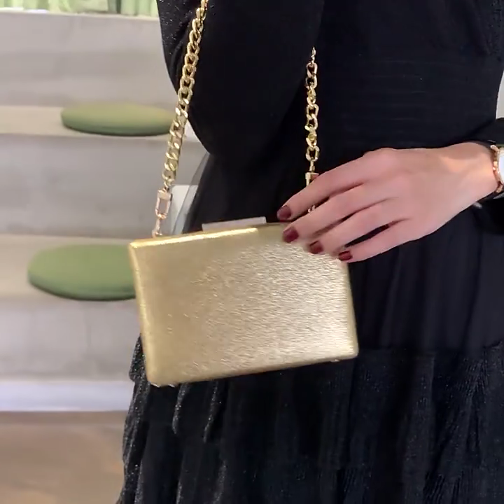 Can I wear gold accessories with a black dress?