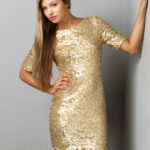 What type of jewelry can I wear with a gold sequin dress on NYE?
