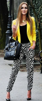 Can I wear a solid color top with black & white print pants?