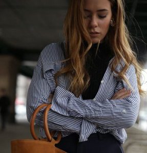 Can you wear a button down shirt over a black turtleneck?