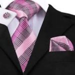 Will a blush pink & navy blue striped tie work with a men's black suit?