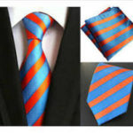 Will a blush pink & navy blue striped tie work with a men's black suit?