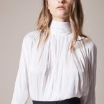 Is a turtleneck blouse or top, okay for a slim, mid height lady?